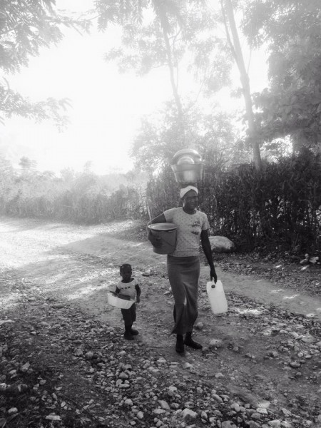 A mother and her child walking the streets in Dèsarmes, Haiti. 